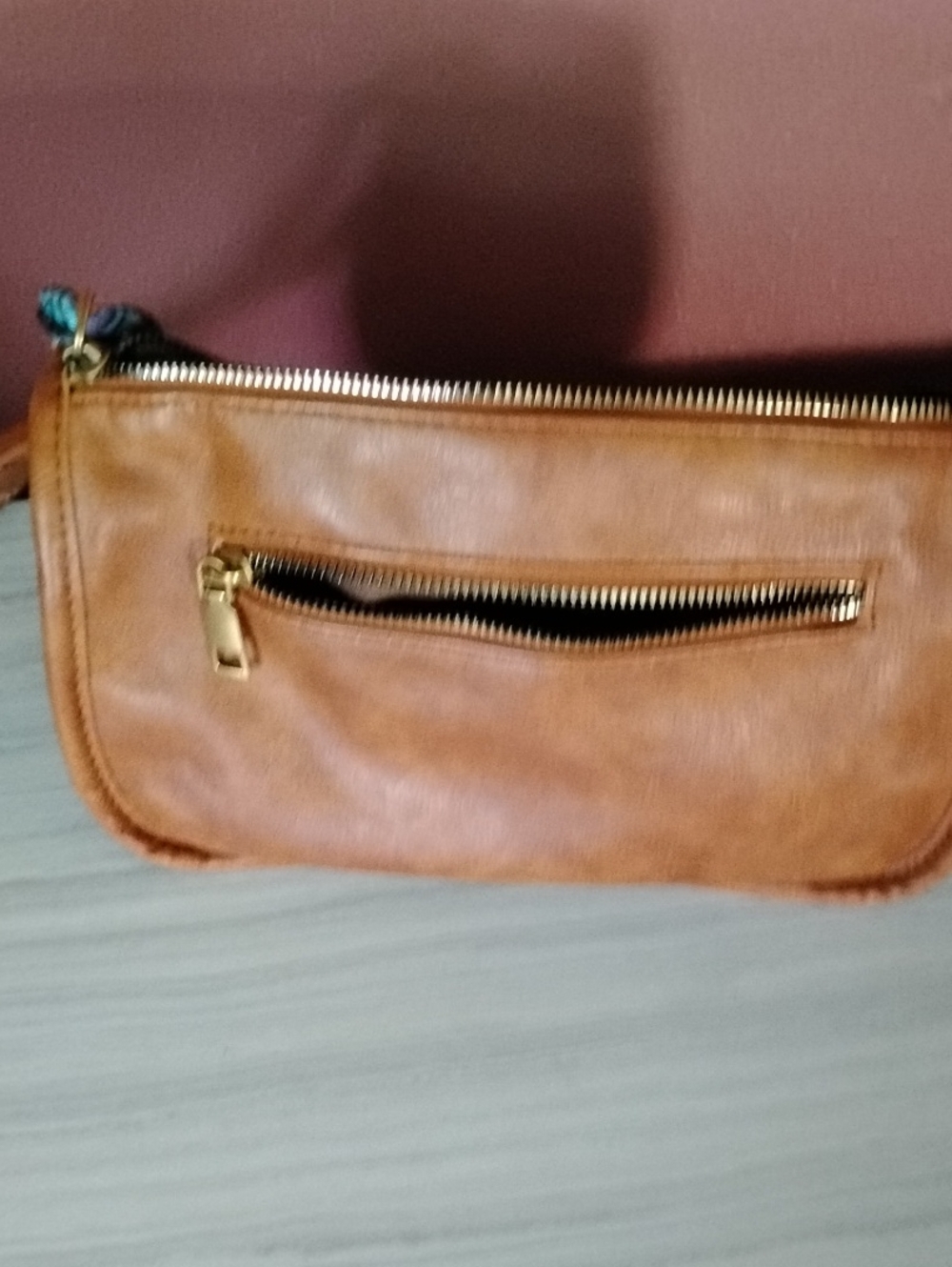 Sleek Tan Leather Wristlet with Gold Zip Accent